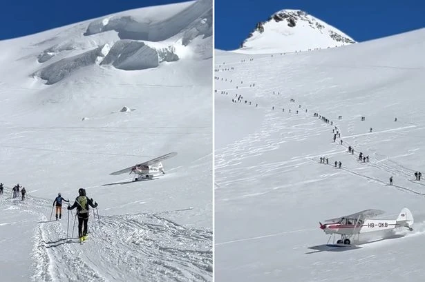 Plane speeds through group of skiers in wild near miss after landing on snowy mountain