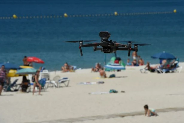 Brit holiday warning as 'towel police' launch drones to target sunbed hogs with £260 fines
