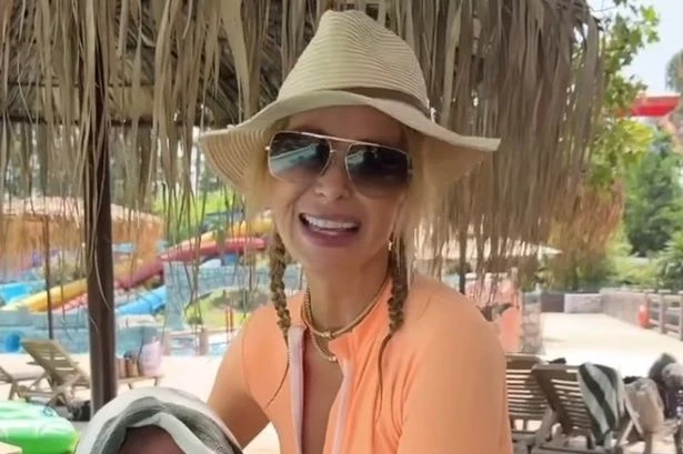 Amanda Holden bares legs in zip-up swimsuit for 'adult baby' trend with TV pal