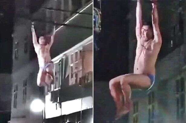 Half-naked bloke swings from overhead lines 'like Tarzan' while fleeing hotel in briefs