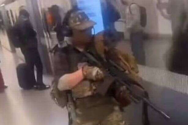 Horror moment man wields 'sniper rifle' on London Underground as train pulls into platform