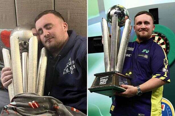 Littler poses in bed with trophy as eagle-eyed fans notice detail on duvet