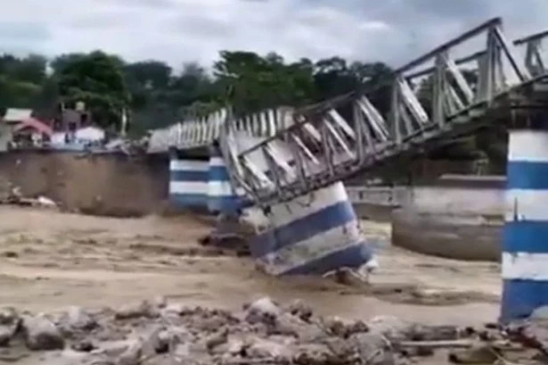 Massive landslide kills 24, including 7 children, as video shows building collapse into river