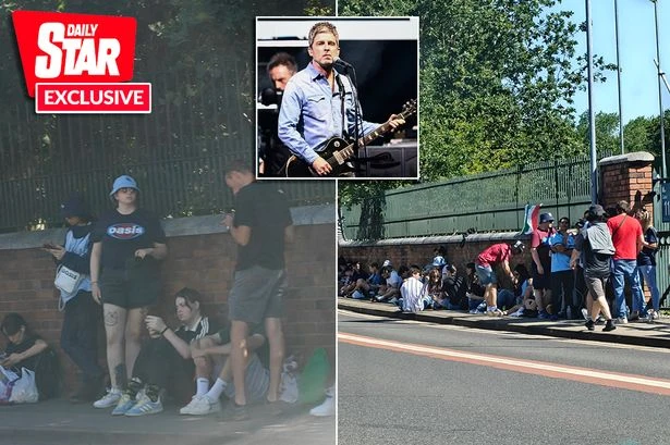 Oasis fans queue up 12 hours early in 33c heatwave as bucket hats fill streets