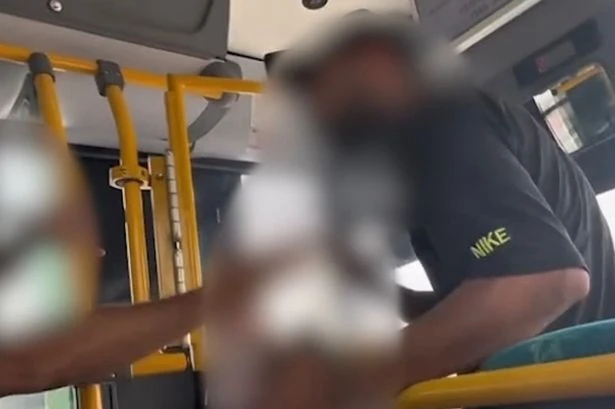 Wild moment fuming bus passenger attacks driver and attempts to take over the wheel