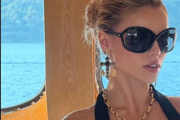 Baywatch's Brooks Nader risks spilling over risky plunging top as curves almost slip out