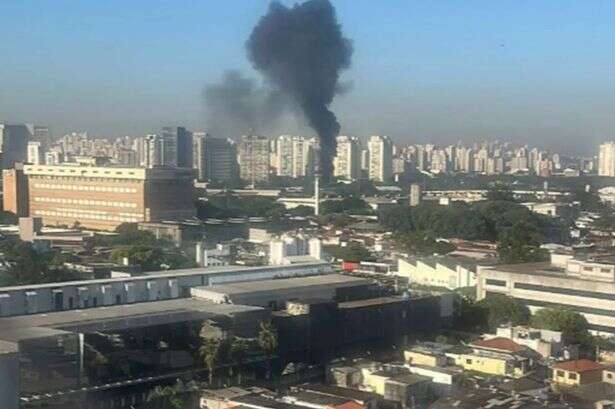 BREAKING Plane plummets and smashes into bus with smoke billowing across city