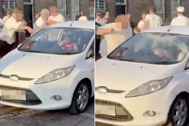 Spurs yobs attack Arsenal fans' car and hurl drinks as 'children cower inside'