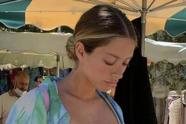 Instagram model ditches undies as she rocks racy sheer dress on cheeky day out