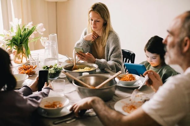 Quarter of British families eat in silence – and kids blame phone addict parents
