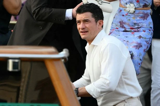 Orlando Bloom flying solo at Jeff Bezos' wedding as he brushes off Katy Perry 'split'