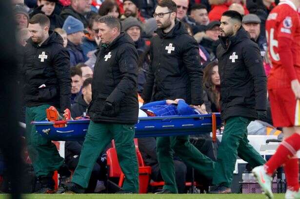 Ipswich star Wes Burns strechered off against Liverpool after collapsing to the ground