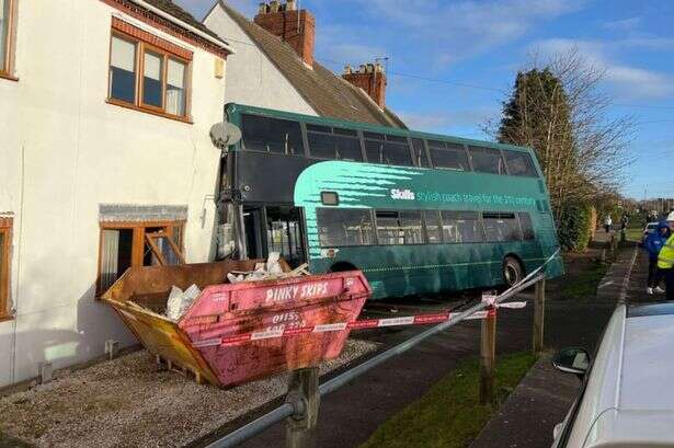 School bus horror as double decker crashes into side of house in UK village