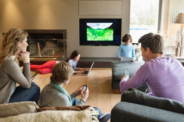 Average family uses three screens at the dinner table as tech addiction soars