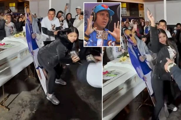 'Grieving' widow twerks on cutout of dead husband next to open casket as guests cheer