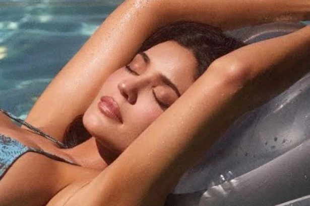 Kylie Jenner slips off g-string as she writhes on floor in just stiletto heels