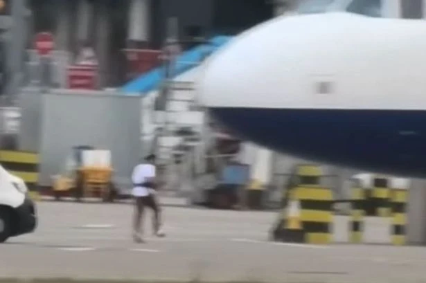 Man legs it across Heathrow Airport tarmac while planes land as staff struggle to catch up