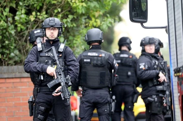 Member of public killed in synagogue rampage as another 'fights for life'