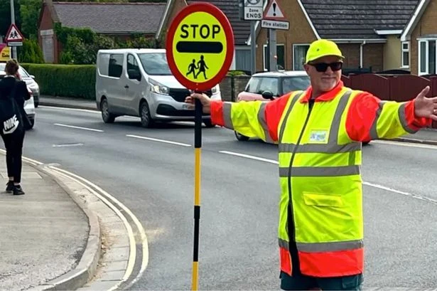 Lollipop man banned from high-fiving kids as they cross the road due to moron drivers
