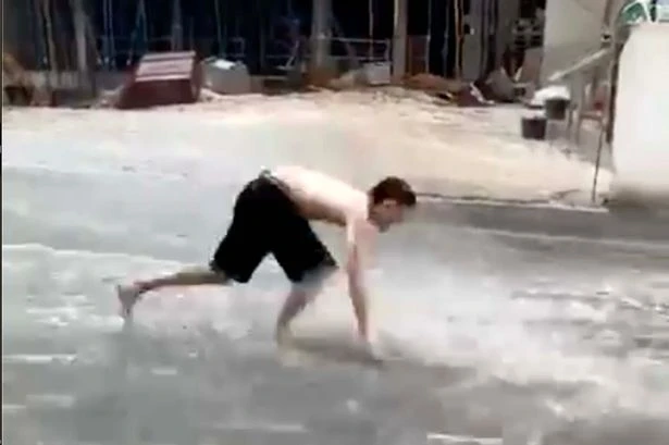 Biblical rain in Benidorm as Brits swim down high street while beaches flood