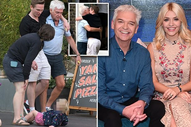 Phillip Schofield clings onto male companion as he leaves bar after failed TV comeback