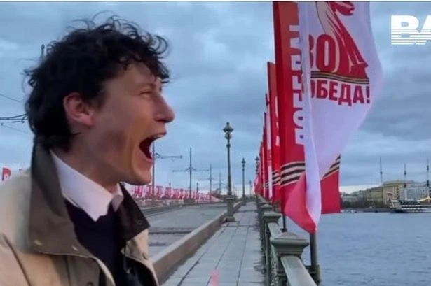 Mad Russians are taking over a bridge to 'scream' every morning as Putin's war takes huge toll 