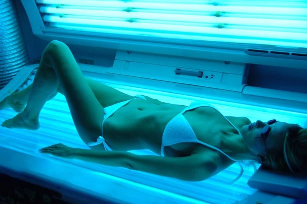Doctors demand all sunbeds banned in UK as young women blighted by skin cancer