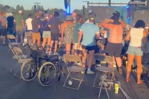 Dozens of 'disabled' Oasis fans get out of wheelchairs and start dancing when music starts