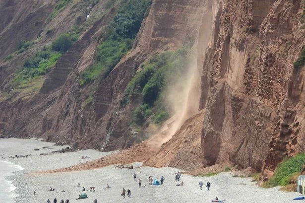 Sunbathers stranded after cliff comes crashing on Devon beach
