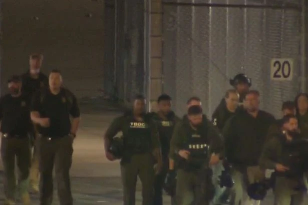 Prison riot sees three guards held hostage as police swarm in to stop jail break