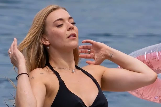 Becky Hill wows in tiny black bikini as she celebrates hen party at luxury resort