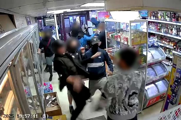 Shocking moment a feral gang of balaclava-clad teens battered a shop worker before stealing vapes