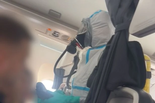 Flight 'pandemonium' as hazmat suit-clad firefighters storm British Airways plane