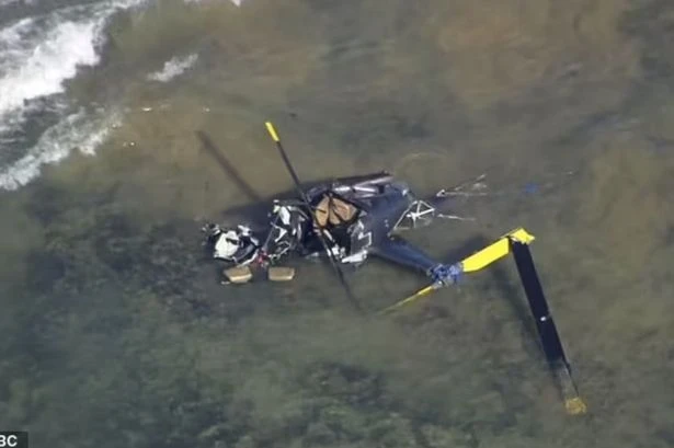 Tourist helicopter plunges into sea with three people on-board near popular destination
