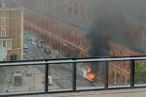 BREAKING 'Explosion' at major UK train station as lorry engulfed in flames in horror pics