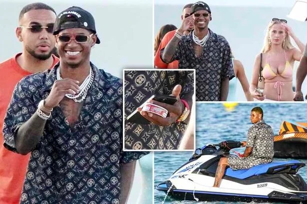 Marcus Rashford snapped with mystery blonde while clutching snus on lavish summer holiday