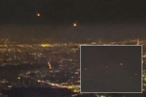 Mysterious orbs spotted hovering over major city as stunned onlooker asks 'could it be UFO?'