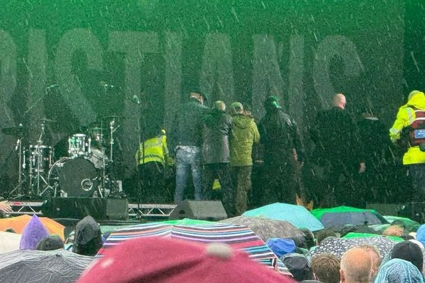Band member suffers 'cardiac arrest on stage' as manager says 'we hope he makes it'