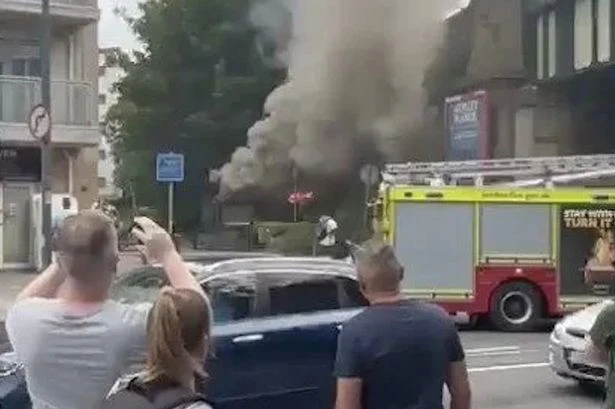 Smoke plume fills UK high street after blaze from 'electrical generator explosion'