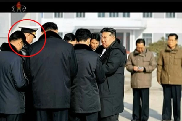 Kim Jong Un makes two officials disappear from months-old state photos prompting execution fears