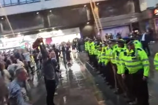 Scotland and England fans face off in London with one tackled to floor by police