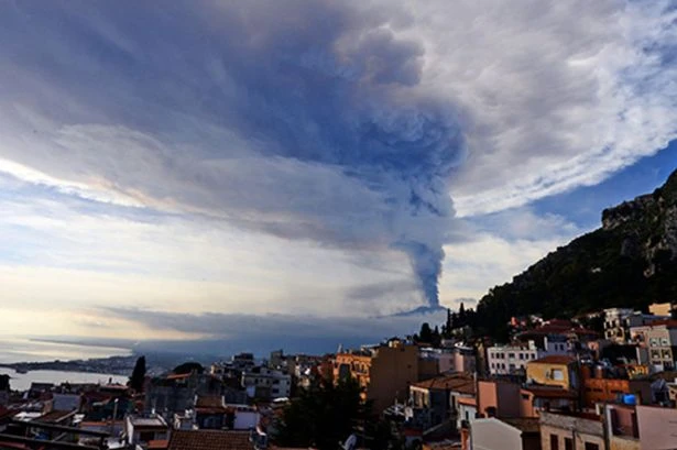Huge Mount Etna eruption triggers red alert as plumes of smoke tower over volcano