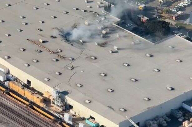 Plane crashes into massive warehouse close to US airport as casualties reported