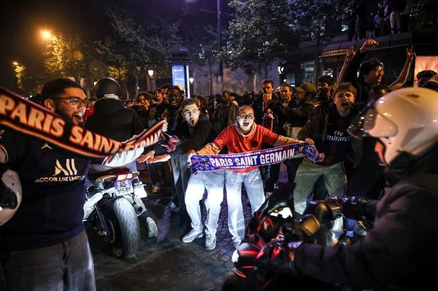 Car plows into group of football fans in Paris after Chamions League match injuring many