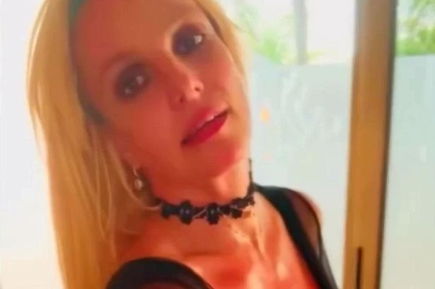 Britney Spears spanks herself, grabs curves and gyrates in see-through bodysuit