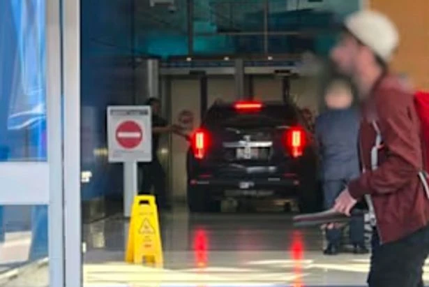 Man ploughs car into major airport terminal screaming 'get out my way b****'