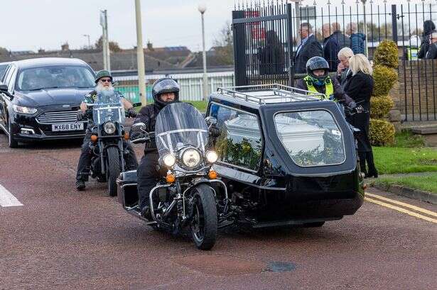 Biker takes final ride in special sidecar hearse next to dream Harley-Davidson motorcycle