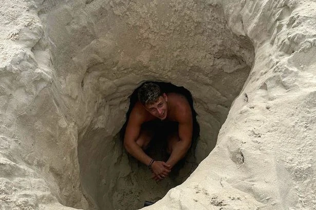 Moment Brit tourist slams beer even though he's being swallowed by sinkhole