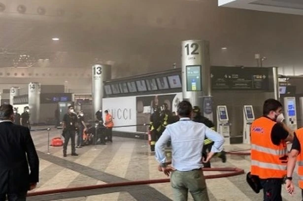 BREAKING Milan Malpensa Airport 'evacuated' after passenger sets 'check-in desk on fire'