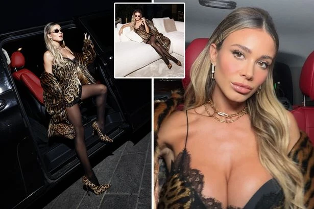 Ex-Premier League star's wife wows in leopard-print lingerie dress at runway show